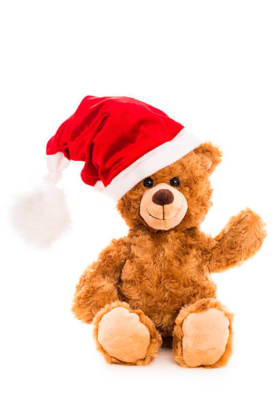 istock Happy Christmas teddy bear waving 174877001