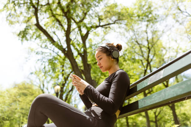 istock Girl checking jogging mobile app after jogging 1748771563