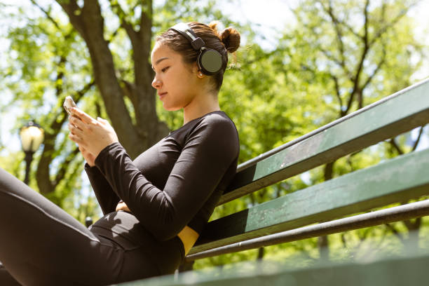 istock Girl checking jogging mobile app after jogging 1748771706