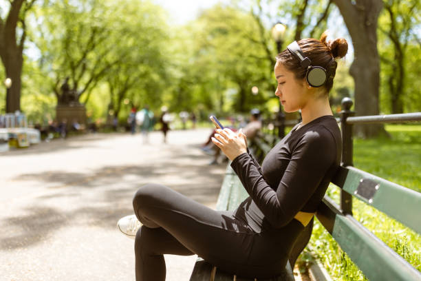 istock Girl checking jogging mobile app after jogging 1748771844