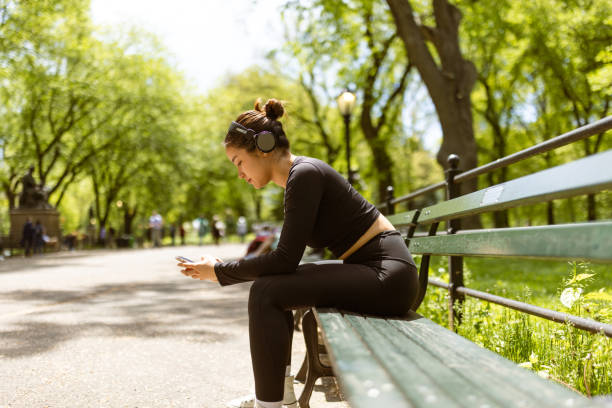 Girl checking jogging mobile app after jogging