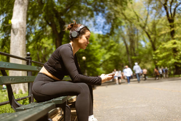 istock Girl checking jogging mobile app after jogging 1748772010