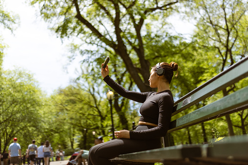 Cute multiracial girl jogging in Central Park, NYC