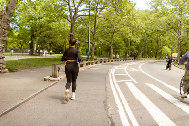 istock Multiracial girl jogging in Central Park 1748774072