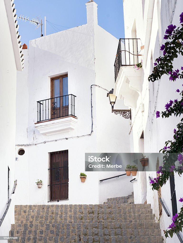 Beautiful corner Andalusian "Street in Arcos de la frontera, Pueblos blancos, in Cadiz, Spain." Arcos de la Frontera Stock Photo
