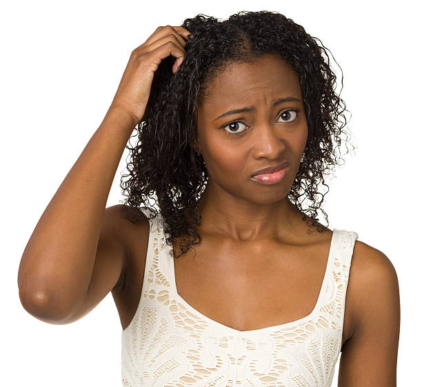 istock Uncertain Young Woman Scratching Her Head 174877444