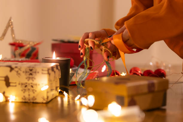 istock A woman is preparing Christmas gift at home. 1748783992