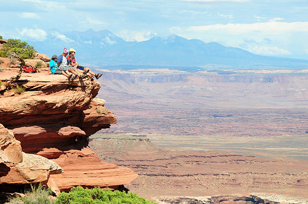 Family Observing view in Canyonlands National Park Image taken at Grand View trailSee More Hiking and the Great Outdoors Images Here: neta degany stock pictures, royalty-free photos & images
