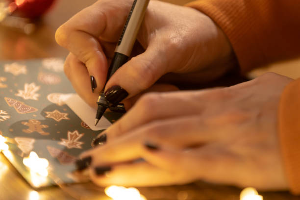 istock A woman is preparing Christmas gift at home. 1748785656