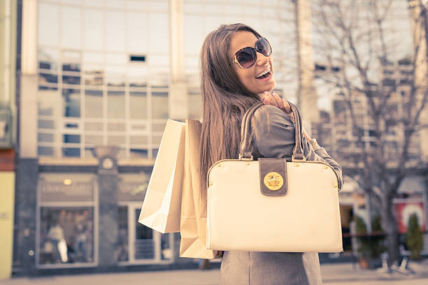 istock Smiling girl with shopping bags 174878599