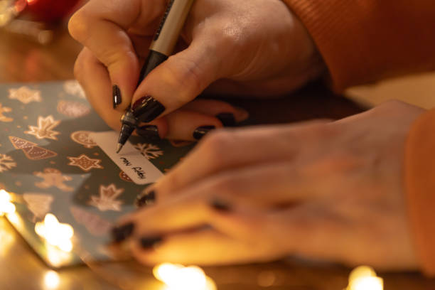 istock A woman is preparing Christmas gift at home. 1748786163