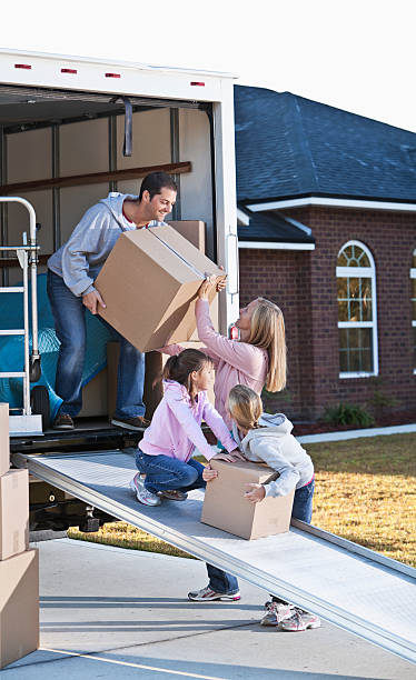 istock Family moving house, unloading truck 174878843