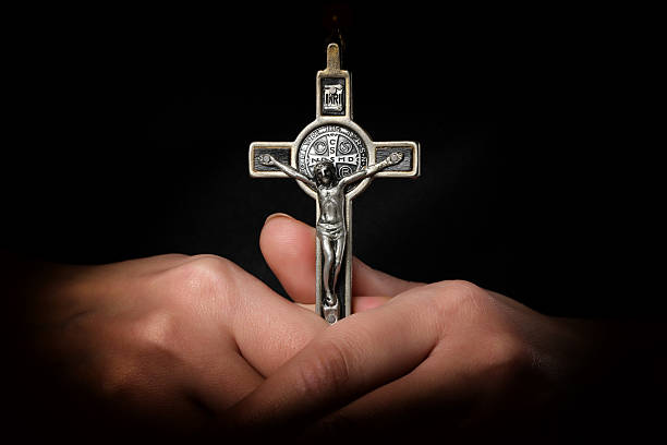 Cross in Hands Cross in Handssimilar images: exorcism stock pictures, royalty-free photos & images