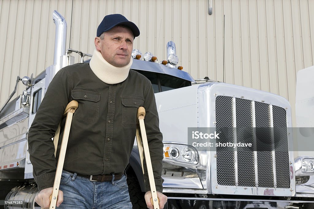 Conductor de camión lesión - Foto de stock de Camionero libre de derechos