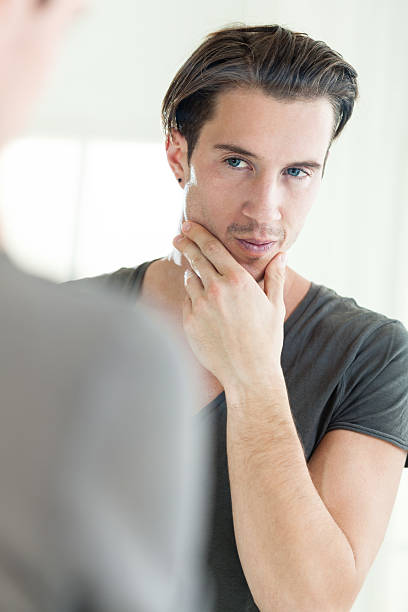 istock Man looking at himself in the mirror 174879323