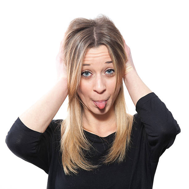 istock Blond girl making a face, sticking out tongue 174879490