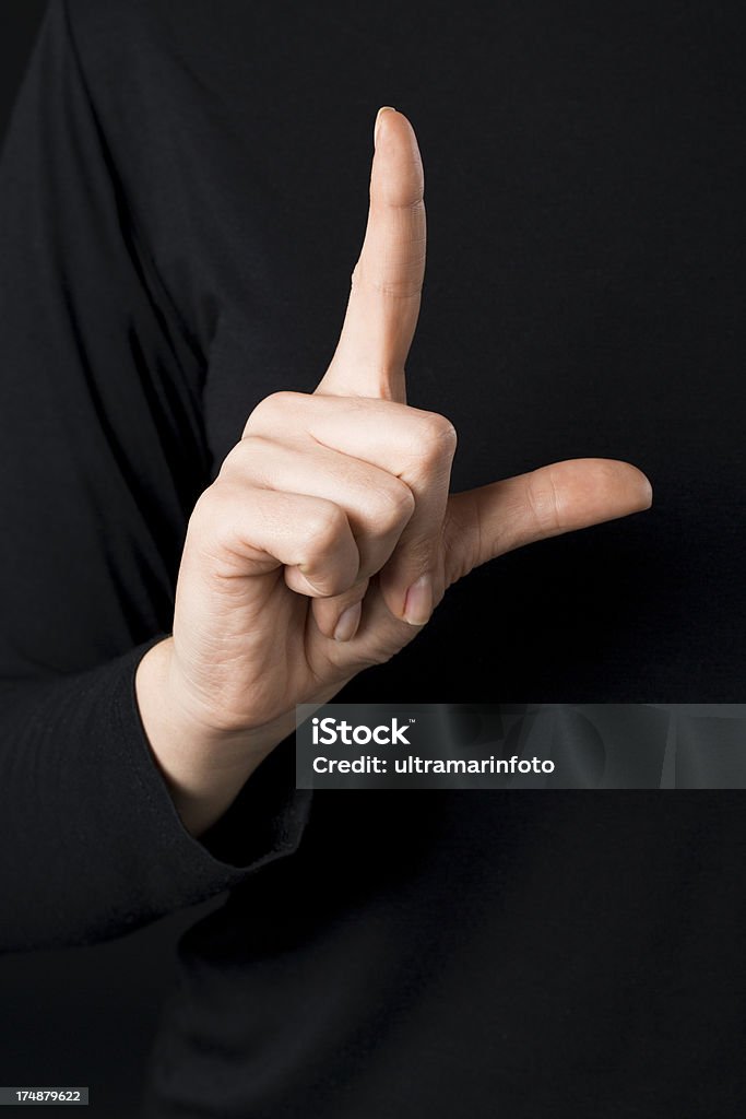 Deaf signs - letter L "Hand sign language letter L , written by fingers, deaf signs. Alphabet for deaf people." Letter L Stock Photo