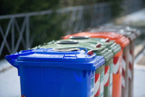 A group of recycling bins along the street (very shallow Depth of field)