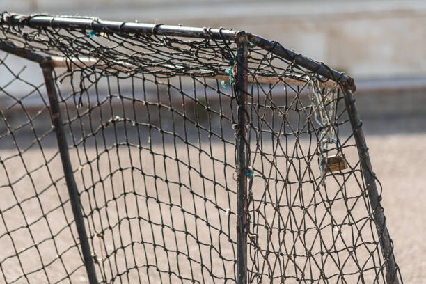 istock PADLOCK PUT ON THE NET OF A GOAL ON THE BEACH 1748798084
