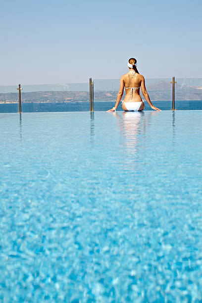 istock Woman at swimming pool 174879983