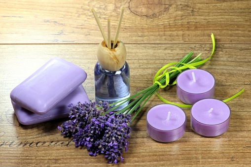 assortment of different lavender products on wooden background