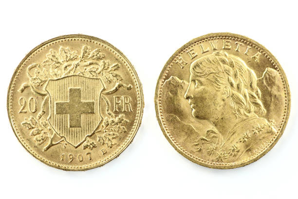 Swiss Vreneli gold coins Swiss Vreneli gold coins isolated on white background swiss gold coin stock pictures, royalty-free photos & images