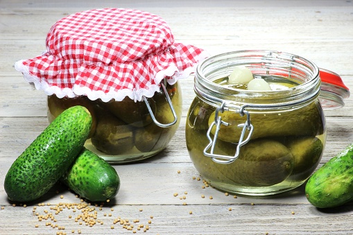 home canned gherkins on wooden table