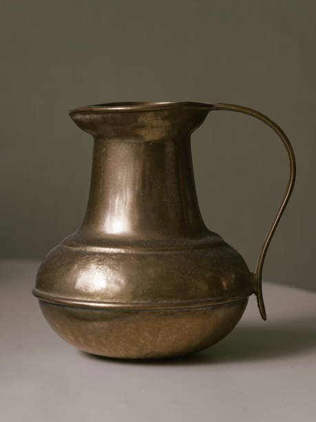 istock copper or brass antique handmade jug, isolated on a white background 1748897847