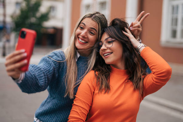 istock Two beautiful girls taking selfie 1748918171