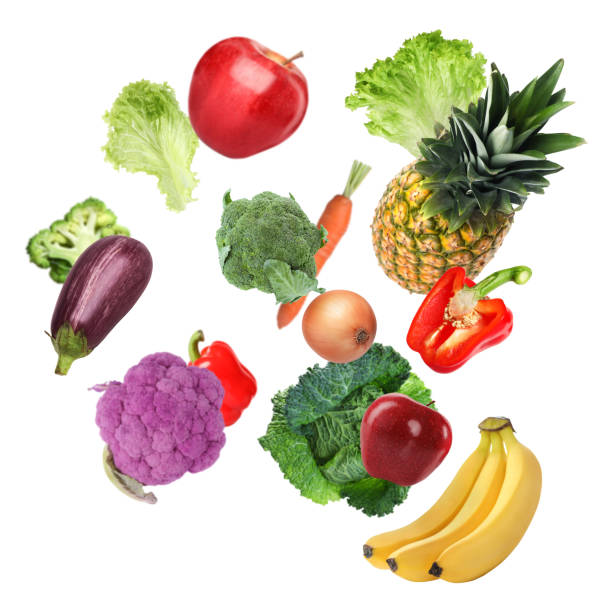 istock Many fresh vegetables and fruits falling on white background 1748926426