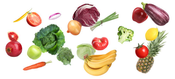 istock Many fresh vegetables and fruits falling on white background 1748926934