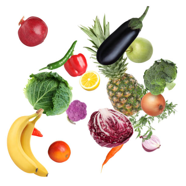 istock Many fresh vegetables and fruits falling on white background 1748926947