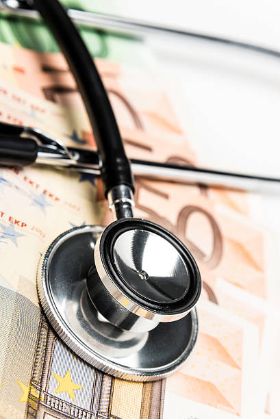 istock A stethoscope on a surface of a row of large Euro notes 174893393