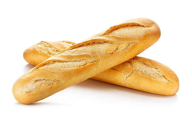 Two Baguettes with Clipping Path Two baguettes isolated on white background with clipping path. baguette stock pictures, royalty-free photos & images