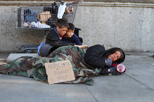 Homeless Family Mom Sick "Shot in Riverside, California in January 2013." family mother poverty sadness stock pictures, royalty-free photos & images