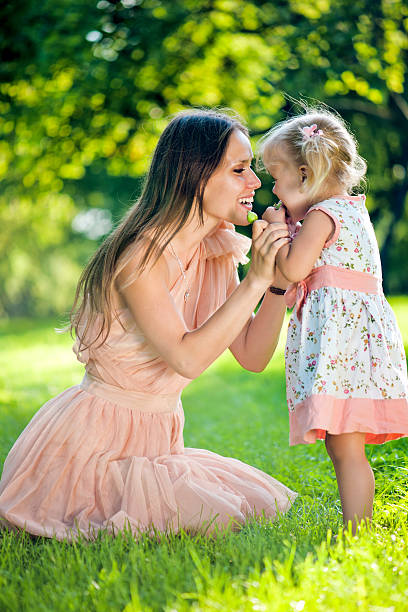 istock Young mother with her daughter in park 174893765