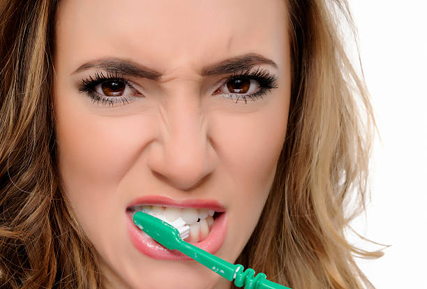 bad день - brushing teeth healthcare and medicine cleaning distraught стоковые фото и изображения