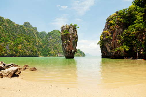 Khao Phing Kan is a pair of islands on the west coast of Thailand, in the Phang Nga Bay, Andaman Sea, near Phuket. About 40 metres from its shores lies a 20 meters tall islet Ko Tapu or Khao Tapu. The island is a part of the Ao Phang Nga National Park. Since 1974, when it was featured in the James Bond movie The Man with the Golden Gun, it is popularly called James Bond Island.