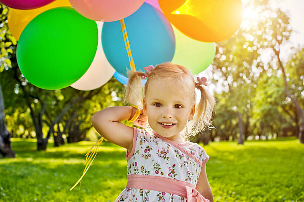 istock Cute girl with balloons 174893912