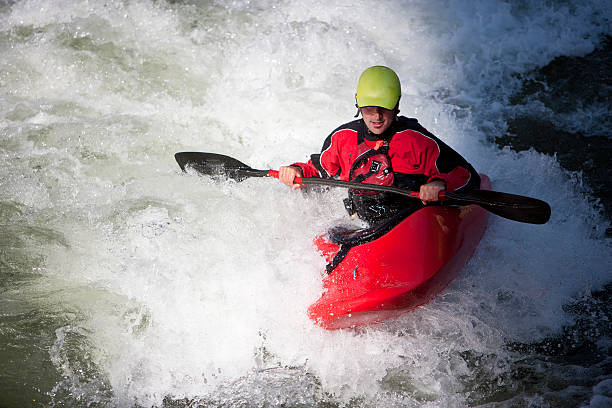 istock Man Paddling a White Water Kayak on a Montana River. 174894095