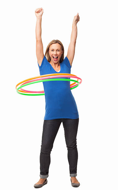 alegre mujer bailando hula hooping aislado - hooping fotografías e imágenes de stock