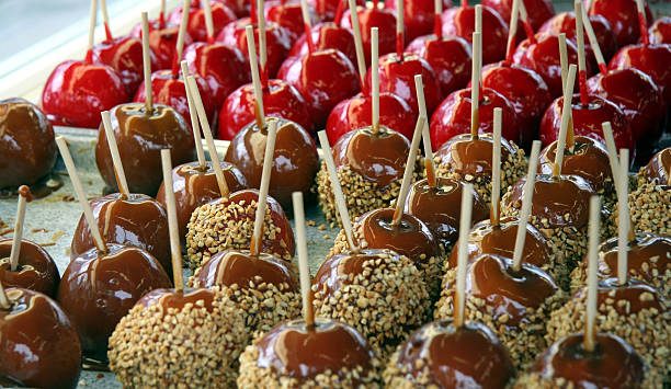 istock Caramel Apples with Nuts on a tray at the fair 174894247