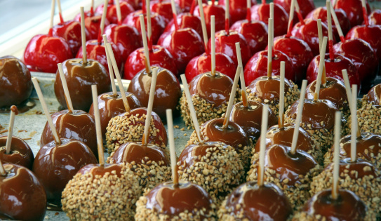 Tray of candied and caramel apples.See more carnival and fair photos: