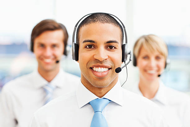 istock Male Call Centre Representative With Coworkers In Background 174894666