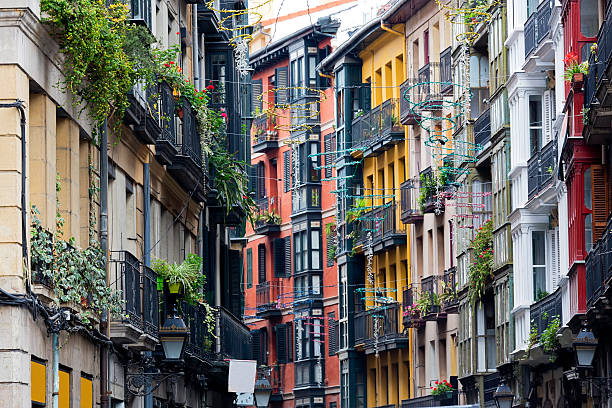 A street in the city of Casco Vieno, Bilbao Details of the multi colored facades of the old buildings in Bilbao's Casco Viejo. panama city panama stock pictures, royalty-free photos & images