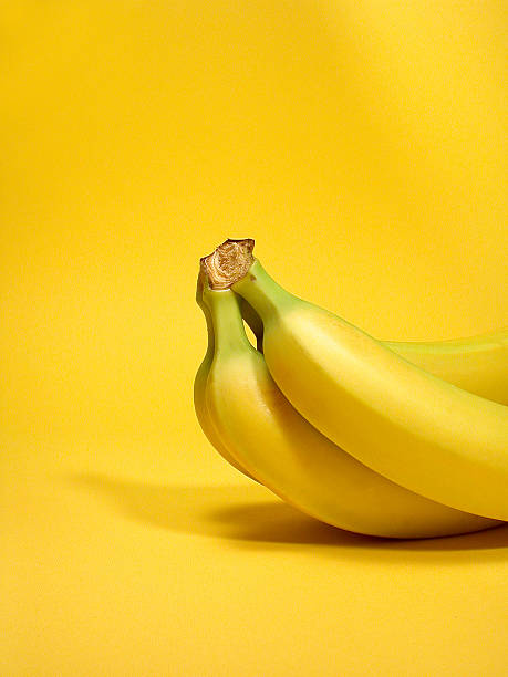 バナナズ - banana bunch yellow healthy lifestyle ストックフォトと画像