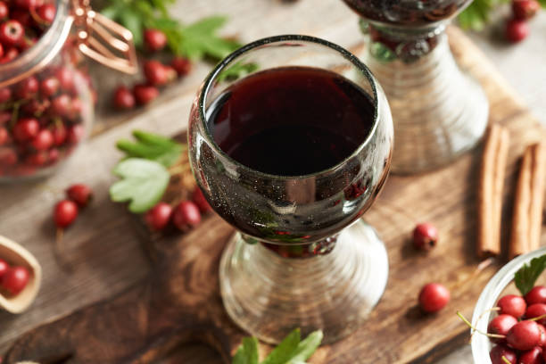 istock Medicinal wine made of fresh hawthorn berries on a table 1748954537