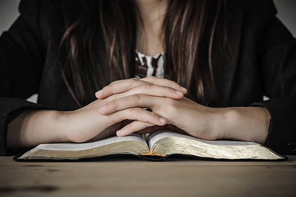 istock Woman reading from the Bible. 174895549
