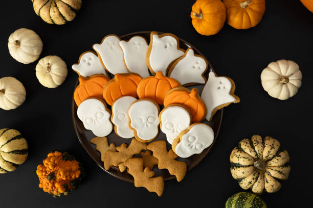 istock Scary Halloween cookies with icing sugar on a plate on a dark background 1748957428