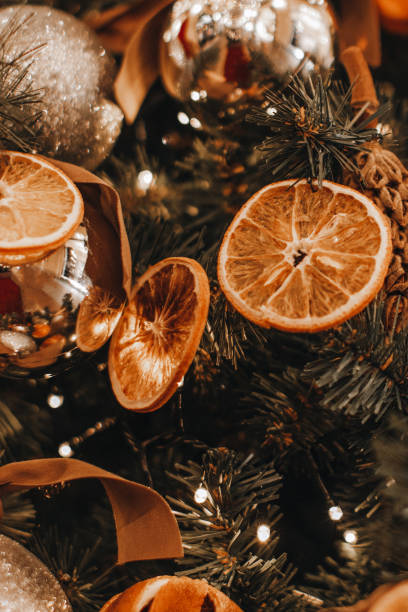 istock Christmas tree decorations made from dried sliced oranges and mandarins. 1748961581